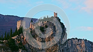 Arco castle on rocky cliff horizontal pan of Trentino Alto adige - Trento - Italy landmarks