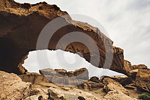 Arco de Tajao is natural sandstone arch in Tenerife, photo