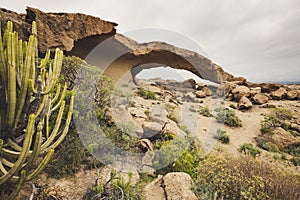 Arco de Tajao is natural sandstone arch in Tenerife, Canary Islands photo