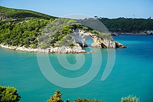 Arco di San Felice, Puglia, Italy with blue waters photo