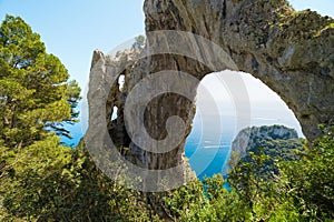 Arco Naturale, natural arch on coast of Capri island, Italy photo