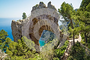 Arco Naturale, natural arch on coast of Capri island, Italy photo