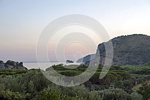 Beautiful panoramic view of a section of Palinuro coastline at sunset. Landscape. photo