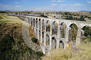 Arcos del Sitio Arcos Site historic aqueduct in Tepotzotlan, Mexico photo