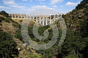 Arcos del Sitio Arcos Site historic aqueduct in Tepotzotlan, Mexico photo