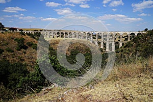 Arcos del Sitio Arcos Site historic aqueduct in Tepotzotlan, Mexico photo