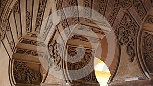 Arcs of Nasrid style in the Alcazaba, ancient muslim palace, Malaga, Spain