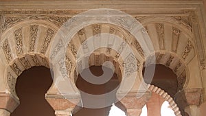 Arcs of Nasrid style in Alcazaba palace, ancient muslim palace, Malaga, Spain