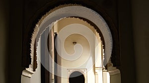 Arcs of Nasrid style in ancient muslim palace of Alcazaba, Malaga, Spain