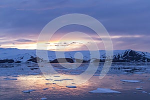 Arctic Glow reflecting in Whalers Bay, Deception Island, Antarctica