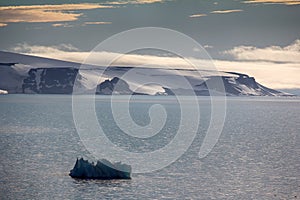 Arctic Islands Glaciers, snowfields, iceberg and rock outcrops photo