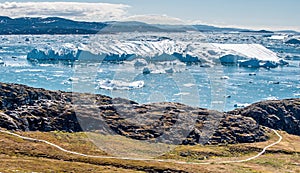 Arctic nature landscape with icebergs in Greenland icefjord.