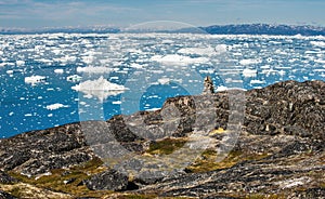 Arctic nature landscape with icebergs in Greenland icefjord. View from a nearby hill, overlooking icebergs from Jakobshavn Glacie