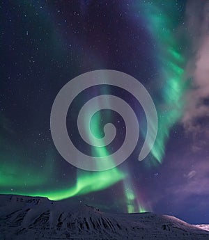 Arctic Northern lights aurora borealis sky star in Norway travel Svalbard in Longyearbyen city the moon mountains