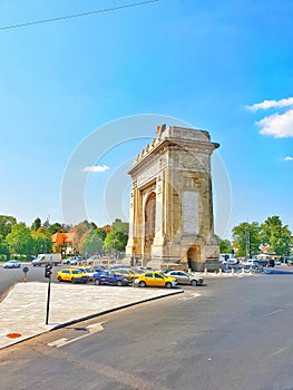 Arcul de Triumf, a triumphal arch of Bucharest, Romania at sunny day. Travel to Romania
