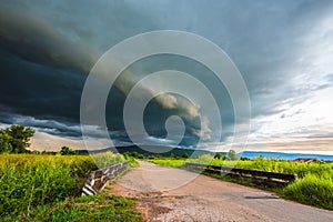 Arcus clouds over the country road photo