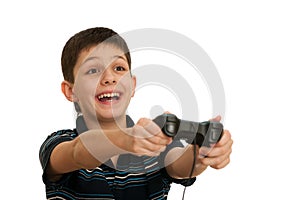 Ardor boy is playing a computer game with joystick photo