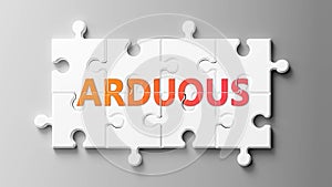 Arduous complex like a puzzle - pictured as word Arduous on a puzzle pieces to show that Arduous can be difficult and needs photo