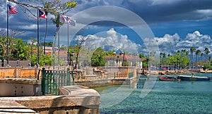 Flags at the edge of the bay, Paseo de la Princesa, Old San Juan, Puerto Rico photo