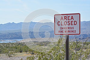 Area Closed Dangerous Mine Workings Sign Abandoned mines in the Lake Mead National Recreation Area. Mohave County, Arizona USA