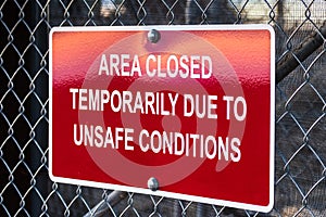 `Area closed temporarily due to unsafe conditions` posted sign