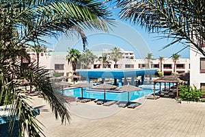 Area hotel with pool and palm trees in Hurghada. Egypt.