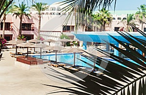 Area hotel with pool and palm trees in Hurghada. Egypt.