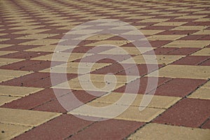 Area of a lock pavement in the bright red and yellow color in the shapes of rectangles and rhombus