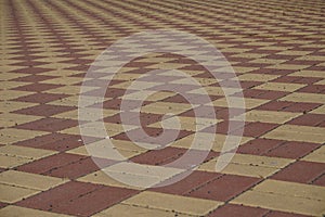 Area of a lock pavement in the bright red and yellow color in the shapes of rectangles and rhombus