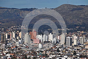 AREA VIEW OF THE CITY OF TANDIL IN A VALLEY WITH LOW MOUNTAINS WITH BUILDINGS IN PROVINCE OF BUENOS AIRES ARGENTINA-