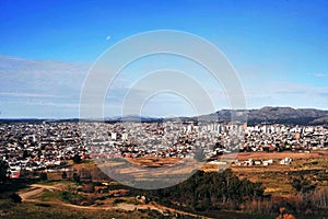 VIEW OF THE CITY OF TANDIL IN A VALLEY WITH LOW MOUNTAINS WITH BUILDINGS IN PROVINCE OF BUENOS AIRES ARGENTINA-OCT 2018