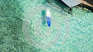 Area view of surfboard floating in the Caribbean Sea