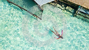 Area view of a woman enjoying the Caribbean Sea