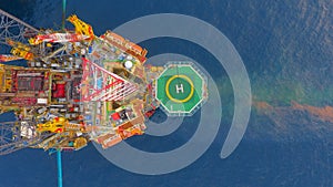 Areal photography from top view of jack up rig scenery with blue ocean view photo