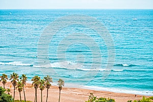 Areal shot of beautiful Jeju island sand beach with lots of enthusiastic surfers swimm