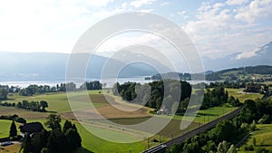 Areal shot of lake zug and rig over the golf course von HolzhÃ¤usern, Switzerland