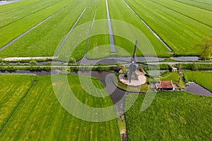 Areal view of Kleine Tiendweg, is a historic wind mill in the middle of fields located near Streefkerk in the Netherlands