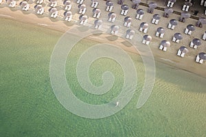 Areal view of sandy Koukounaries beach, turquoise sea, parasols and sunbeds