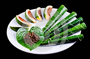 Areca nut, betel nut chewed with the leaf