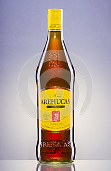 Arehucas rum on gradient background.