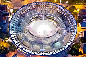 Arena Pula. Ancient ruins of Roman amphitheatre in Pula aerial evening view