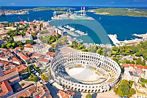 Arena Pula. Ancient ruins of Roman amphitheatre and Pula waterfront aerial view