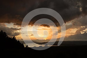 Arenal lake reflection the sun photo