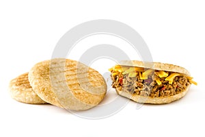 Arepa with shredded beef and cheese isolated. Venezuelan typical food