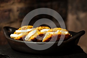 Arepas de choclo filled with white cheese photo