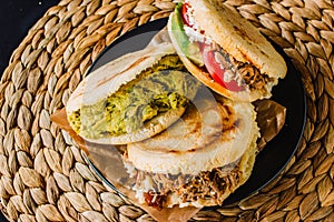 Arepas venezolanas is a traditional dish from Venezuela and Colombia, on a rustic background photo