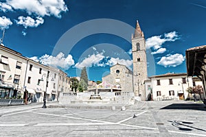 AREZZO, ITALY - MAY 12, 2015: People walk in Saint Augustin Square. Arezzo is one of the most famous tuscan medieval cities