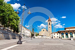 AREZZO, ITALY - MAY 12, 2015: People walk in Saint Augustin Square. Arezzo is one of the most famous tuscan medieval cities