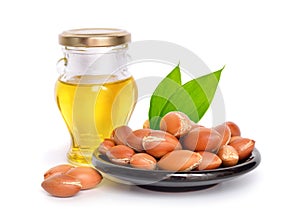 Argan seed with oil. Isolated.