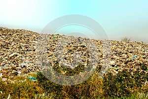 arge garbage mountains The output of consumerism in underdeveloped countries.